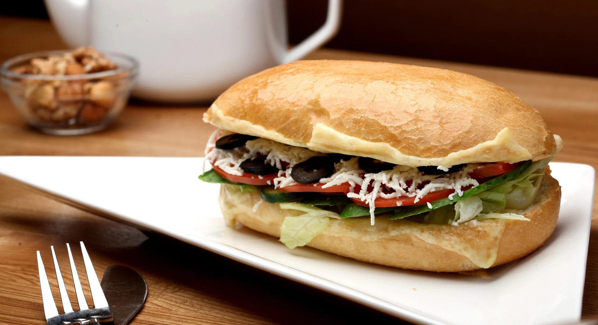London halloumi and pesto sandwich with grilled halloumi, fresh greens, and crusty bread