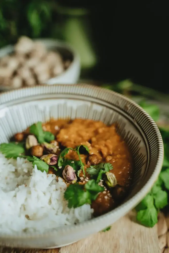 Sweet potato and chickpea curry bowl served with fluffy basmati rice.