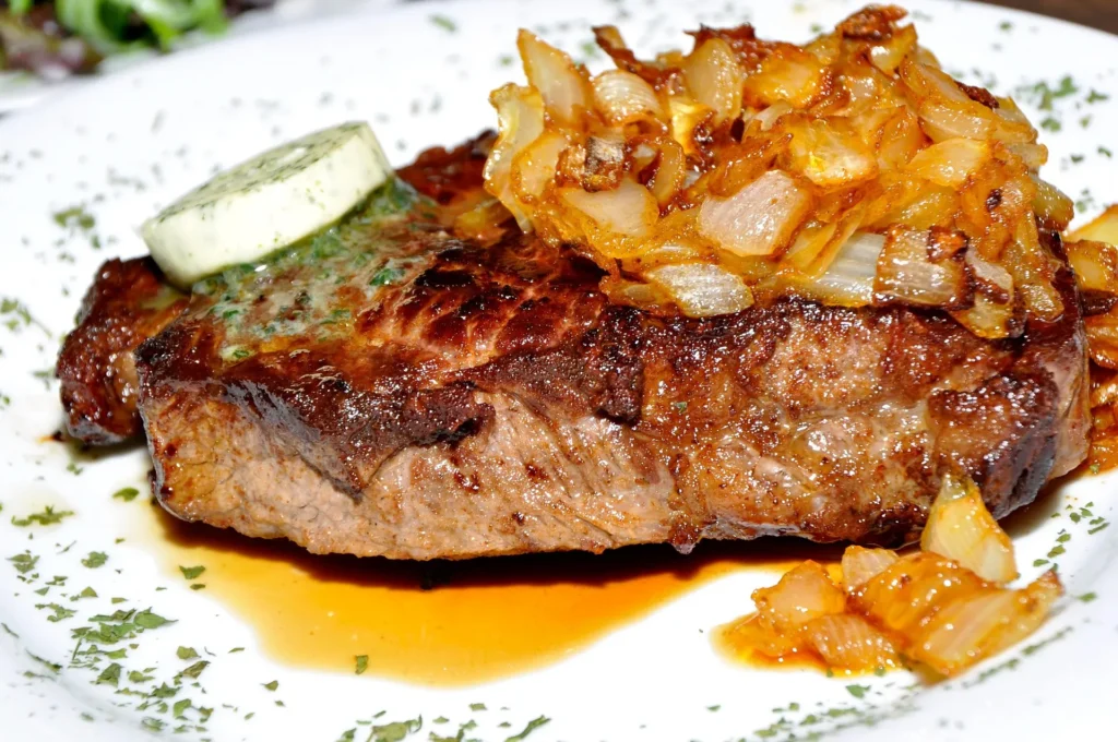 Pan-seared beef steak topped with peppercorn sauce