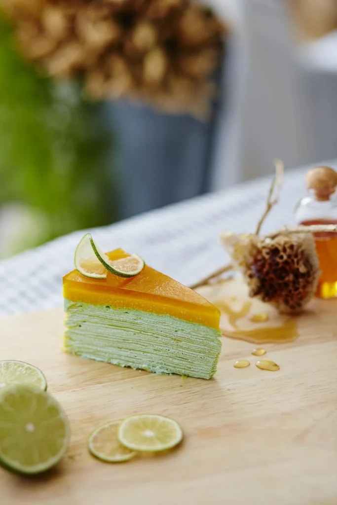 Moist lemon drizzle cake with a crunchy sugar glaze and lemon zest.