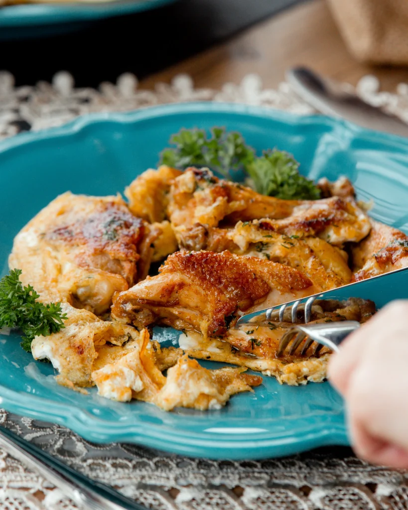 Honey mustard chicken in a skillet with a vibrant, creamy sauce.