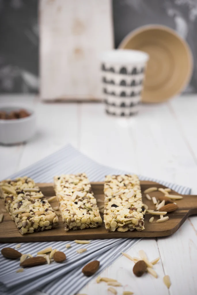 Homemade granola bars close-up, highlighting the chewy texture of rolled oats bonded with premium Manuka honey